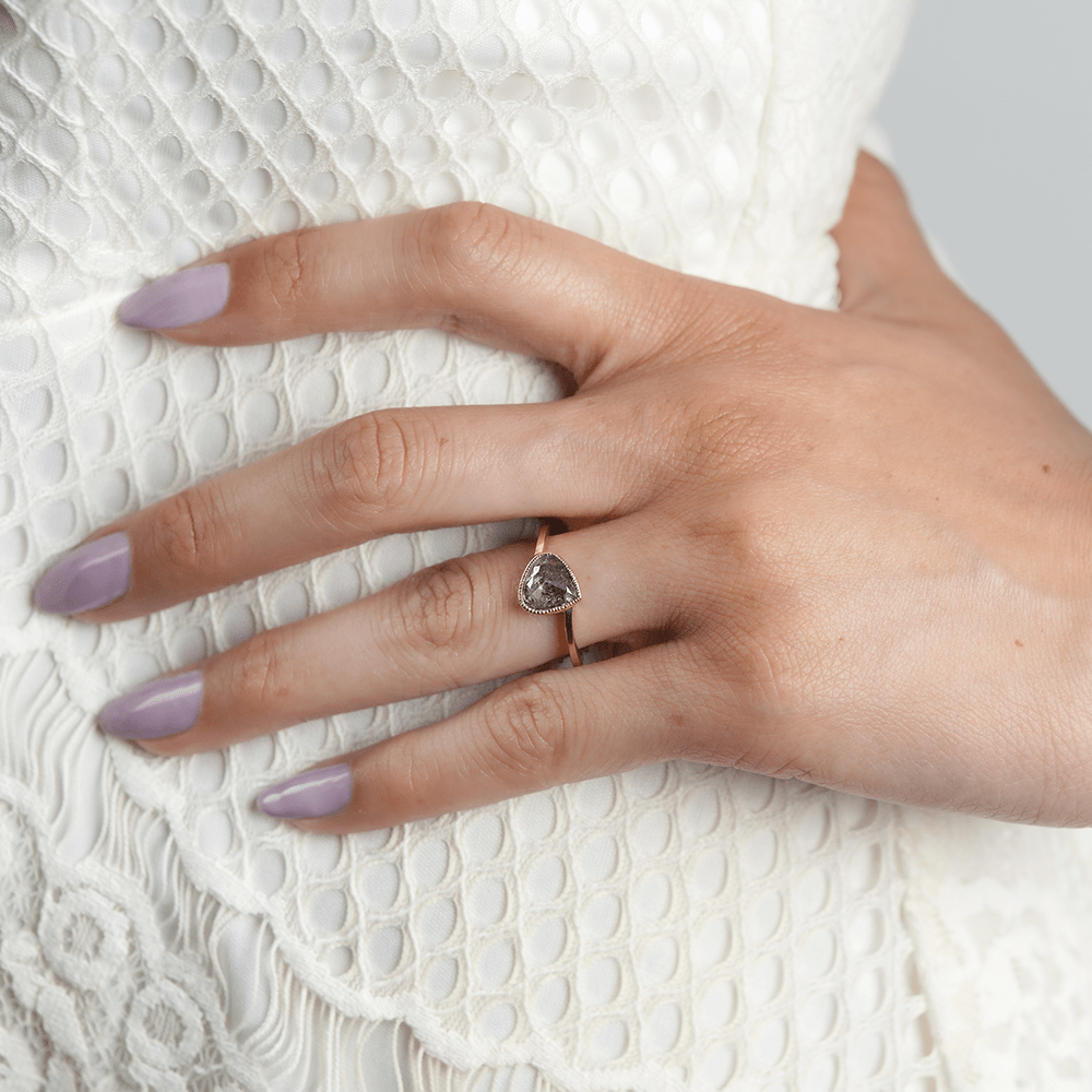 Woman wearing a Solid Gold engagement ring with a salt and pepper stone - Women's Wedding Rings - Manly Bands