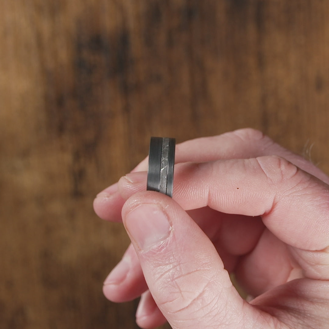 Trying on a men's wedding band made of Black Zirconium (charcoal gray color) with Genuine Gibeon Meteorite - Manly Bands