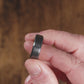 Trying on a men's wedding ring made of Black Zirconium (charcoal gray color) with Authentic Jack Daniel's Whiskey Barrel- Manly Bands